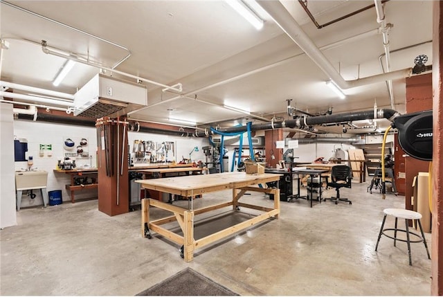 garage featuring sink and a workshop area