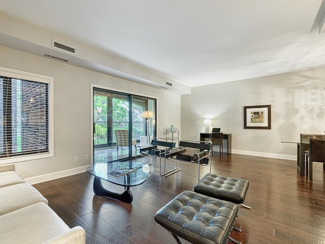 living room with dark hardwood / wood-style flooring