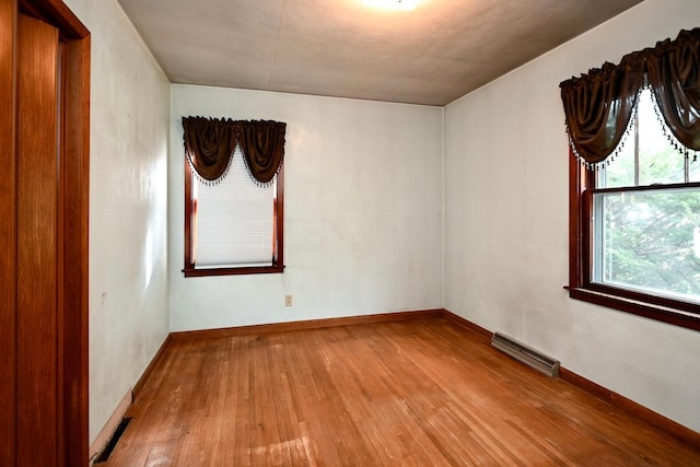 spare room featuring light hardwood / wood-style floors