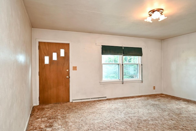 carpeted foyer entrance with a baseboard radiator