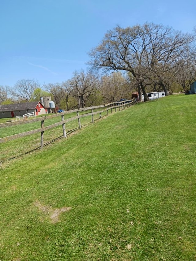 view of yard with a rural view