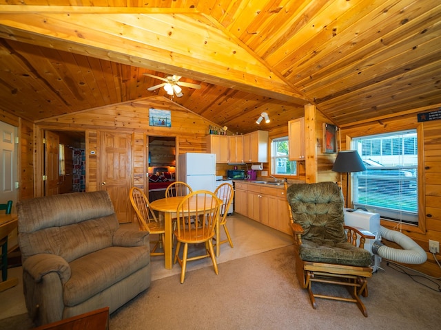 living room with ceiling fan, wooden ceiling, wooden walls, vaulted ceiling, and sink