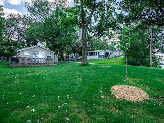 view of yard with a deck