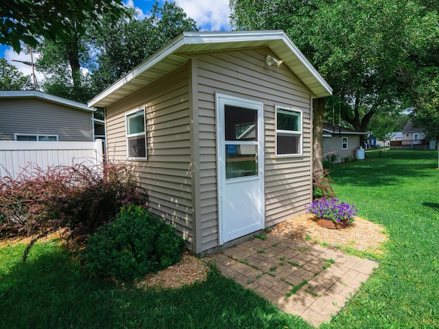 view of outdoor structure with a yard