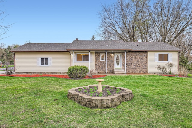 back of house with a lawn and entry steps