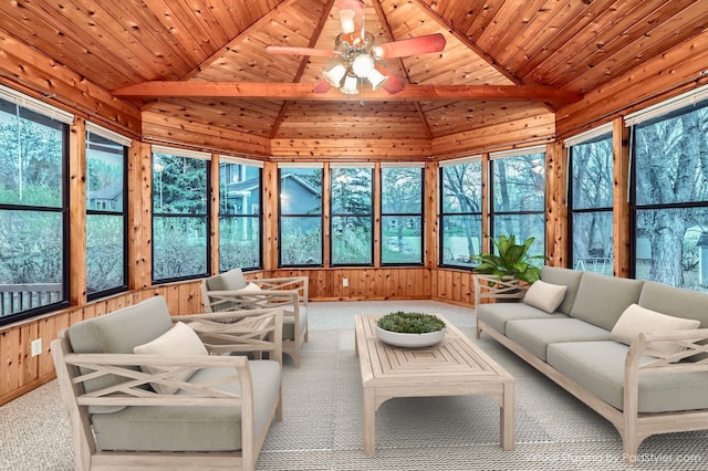sunroom with plenty of natural light, wooden ceiling, and vaulted ceiling with beams