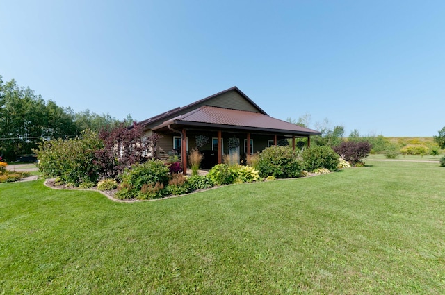 view of side of property with a yard