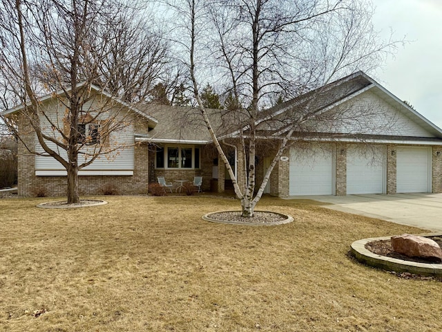 view of front of property featuring brick siding, concrete driveway, and an attached garage