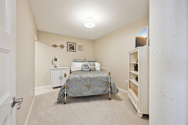 bedroom with light colored carpet