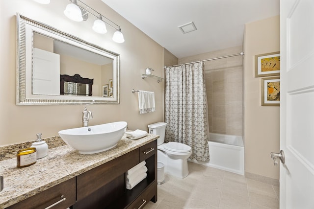 full bathroom with shower / tub combo with curtain, visible vents, toilet, vanity, and tile patterned floors