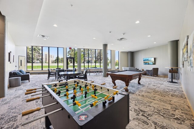 rec room featuring carpet, pool table, expansive windows, and a healthy amount of sunlight