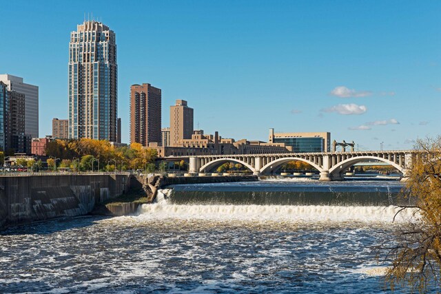 view of property's community featuring a view of city and a water view