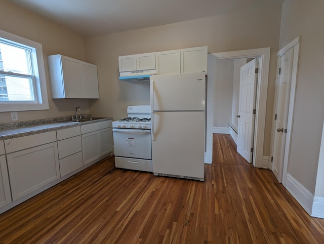 kitchen with under cabinet range hood, dark wood-style flooring, white appliances, white cabinetry, and a sink