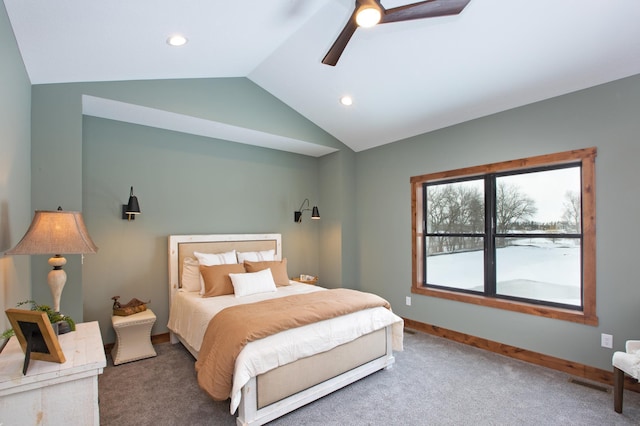 carpeted bedroom with vaulted ceiling and ceiling fan