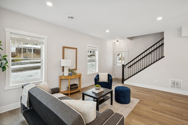 living room with light hardwood / wood-style floors