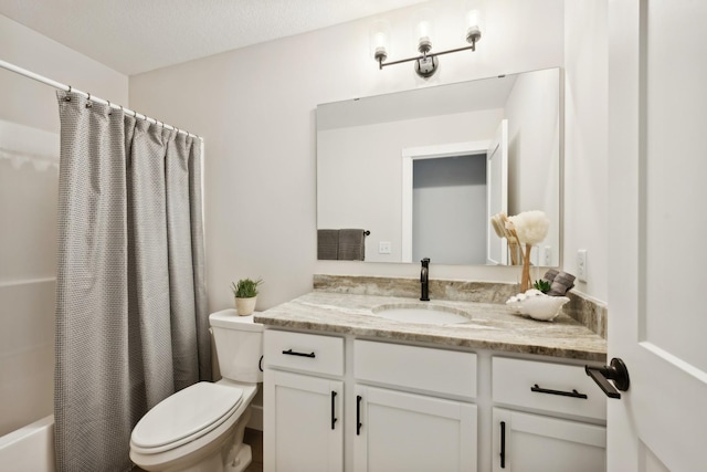 full bathroom with vanity, toilet, shower / bath combo, and a textured ceiling