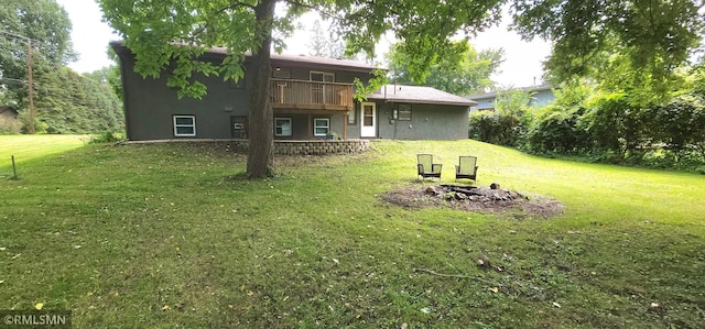 view of yard with a balcony