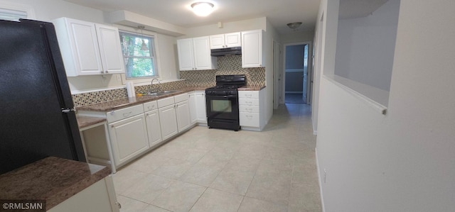 kitchen featuring decorative backsplash, white cabinetry, black appliances, light tile patterned flooring, and sink