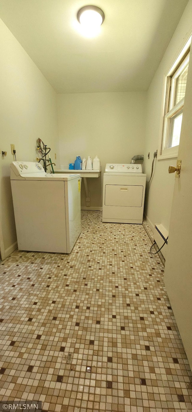 laundry room with independent washer and dryer