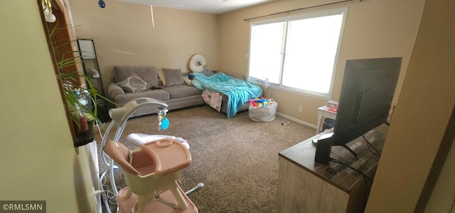 carpeted bedroom featuring multiple windows