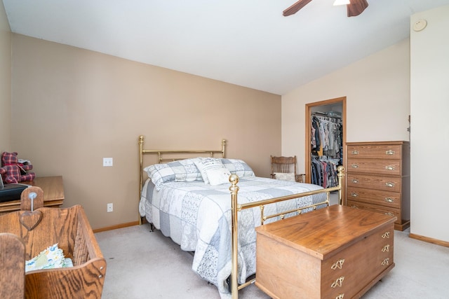 bedroom with a spacious closet, ceiling fan, light colored carpet, and a closet