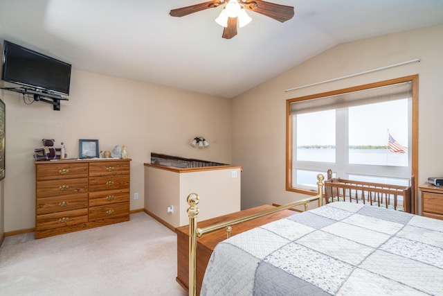 bedroom with ceiling fan, light carpet, and lofted ceiling