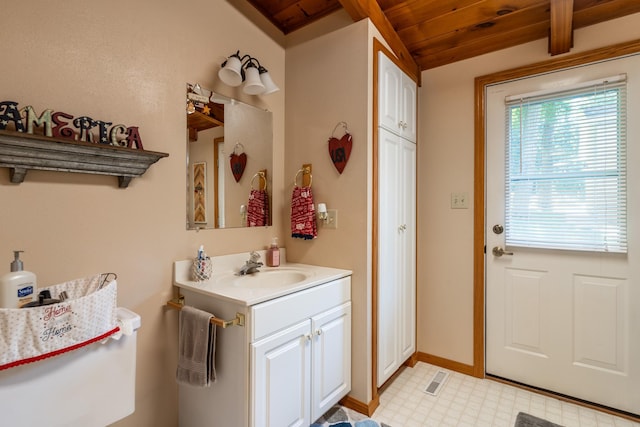 bathroom featuring tile patterned floors, vanity, wooden ceiling, and vaulted ceiling