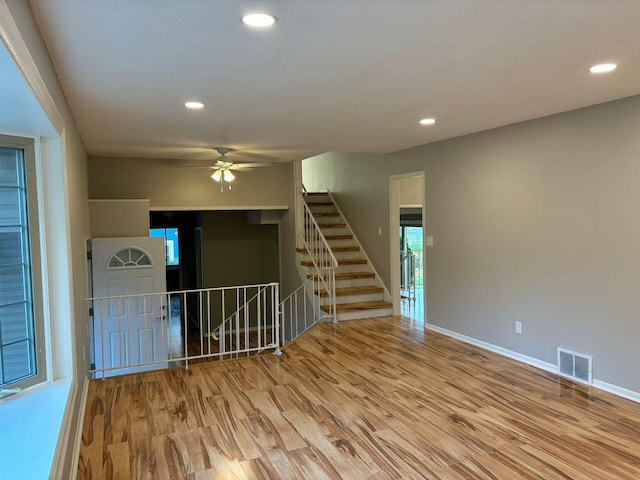 interior space featuring light hardwood / wood-style floors and ceiling fan