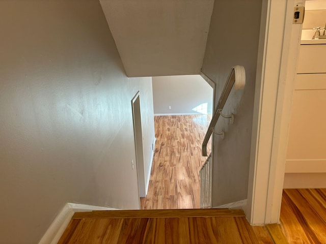 stairway featuring hardwood / wood-style floors