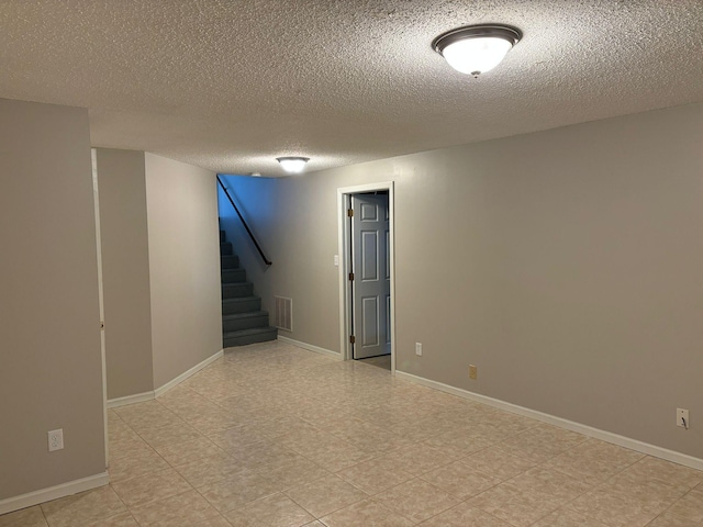 basement with a textured ceiling