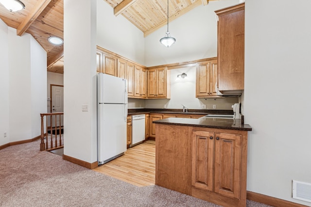 kitchen featuring beamed ceiling, white appliances, pendant lighting, and wooden ceiling