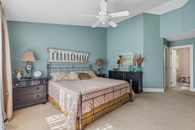 carpeted bedroom featuring ceiling fan and connected bathroom