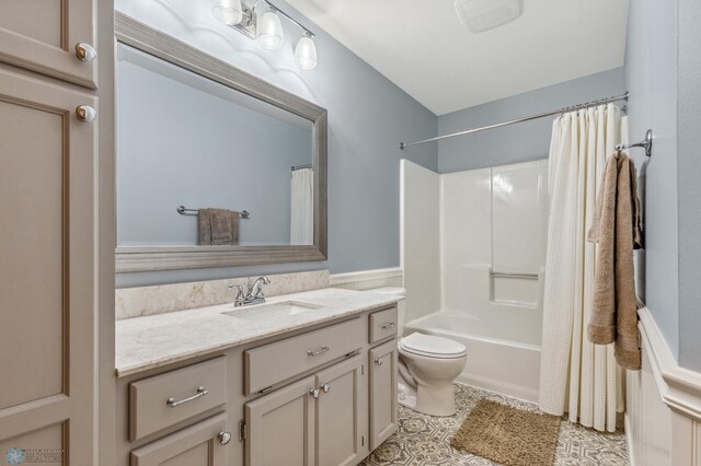 full bathroom featuring shower / bathtub combination with curtain, toilet, vanity, and tile patterned flooring