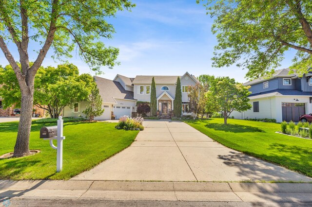 view of front of property with a garage and a front yard