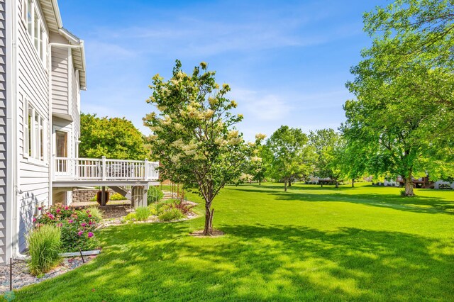 view of yard with a wooden deck