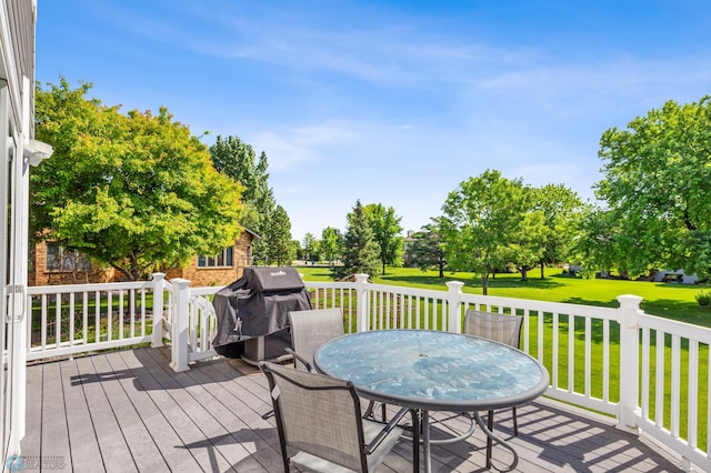 deck with a lawn and a grill