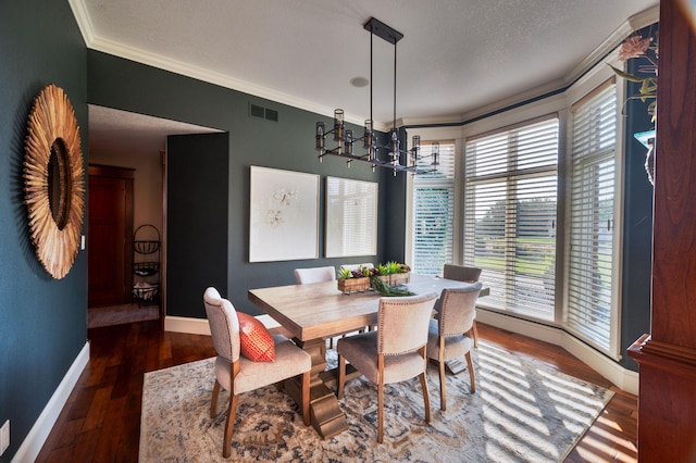 dining area with crown molding, an inviting chandelier, and dark hardwood / wood-style flooring