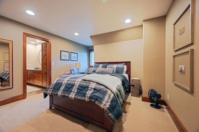 carpeted bedroom with connected bathroom