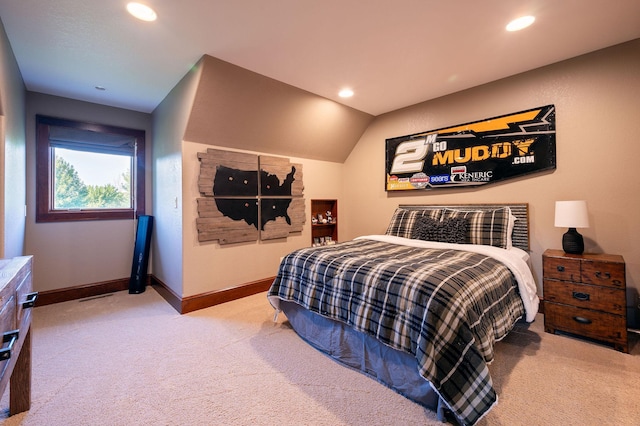 carpeted bedroom featuring lofted ceiling