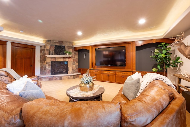 living room featuring carpet floors and a fireplace