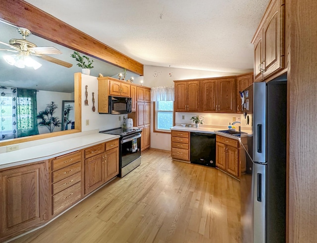 kitchen with ceiling fan, sink, black appliances, vaulted ceiling with beams, and light hardwood / wood-style floors