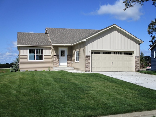 view of front facade with a front yard and a garage