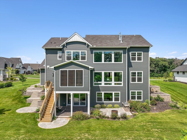 back of house with a yard and a patio area