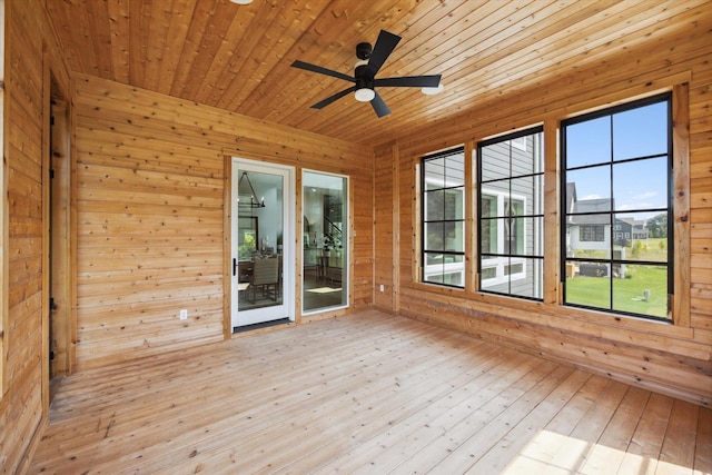 unfurnished sunroom featuring ceiling fan and wooden ceiling