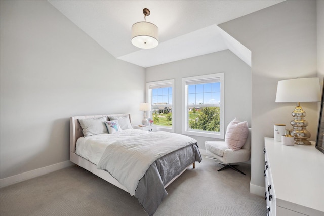 carpeted bedroom with vaulted ceiling