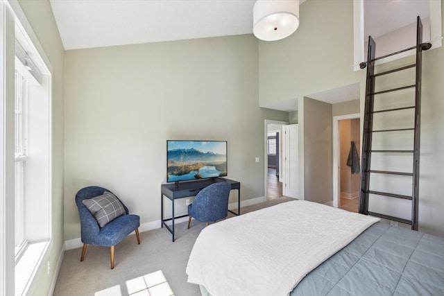 bedroom featuring carpet flooring and lofted ceiling