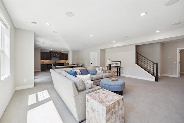 living room featuring light colored carpet