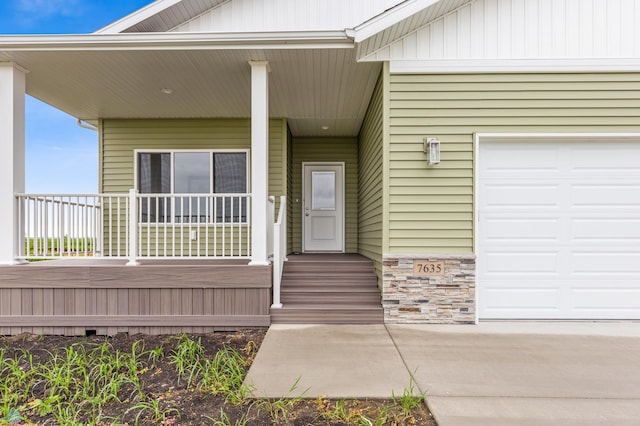 view of exterior entry featuring a porch