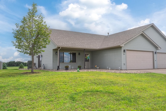 single story home featuring a front lawn and a garage