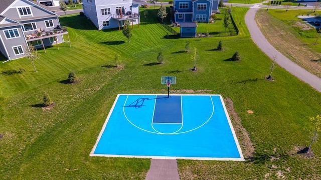 view of sport court featuring community basketball court and a residential view
